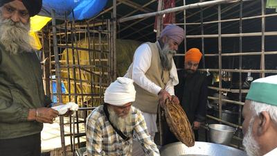 The farmers at UP Gate have been occupying portions of the Ghaziabad-Delhi carriageways of National Highway 9 for almost a year, and hundreds of tents have been set up at the site. (AP) The farmers at UP Gate have been occupying portions of the Ghaziabad-Delhi carriageways of National Highway 9 for almost a year, and hundreds of tents have been set up at the site. (AP)