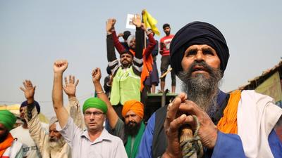 Farmers celebrate at Delhi’s Singhu border protest site after PM Narendra Modi announced that the three contentious farm laws will be repealed. (Sanchit Khanna/ Hindustan Times) Farmers celebrate at Delhi’s Singhu border protest site after PM Narendra Modi announced that the three contentious farm laws will be repealed. (Sanchit Khanna/ Hindustan Times)