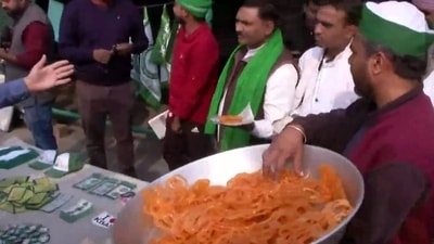 People celebrate at Ghazipur border following PM Modi's announcement to repeal all three farm laws. (ANI Photo) People celebrate at Ghazipur border following PM Modi's announcement to repeal all three farm laws. (ANI Photo)