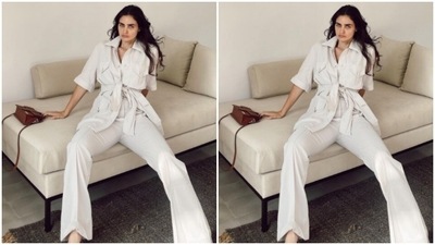 Gabriella gave a twist to formal fashion in a white shirt with a tie-up detail in front. She paired it with a pair of white trousers. (Instagram/@gabriellademetriades) Gabriella gave a twist to formal fashion in a white shirt with a tie-up detail in front. She paired it with a pair of white trousers. (Instagram/@gabriellademetriades)