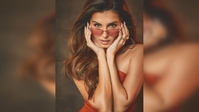 Sharing the photos, Tara Sutaria captioned her post, "Full of 🧡." She accessorised her look with a pair of cool tinted orange shades. (Instagram/@tarasutaria) Sharing the photos, Tara Sutaria captioned her post, "Full of 🧡." She accessorised her look with a pair of cool tinted orange shades. (Instagram/@tarasutaria)