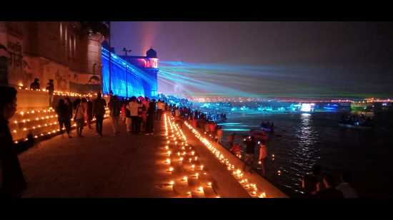 Diyas were lit across the east bank of the Ganga and adding to their beauty was the laser show . (HT Photo) Diyas were lit across the east bank of the Ganga and adding to their beauty was the laser show . (HT Photo)