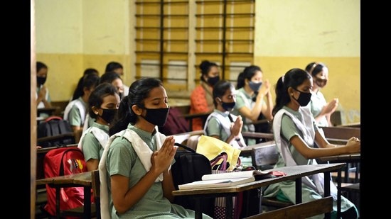 Students pray in their classroom on the first day of reopening of schools, Pune (Hindustan Times)