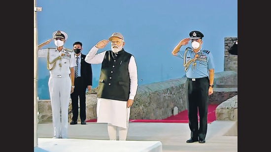 Prime Minister Narendra Modi salutes the National Flag during the Retreat Ceremony, in Jhasi on Friday. (ANI)