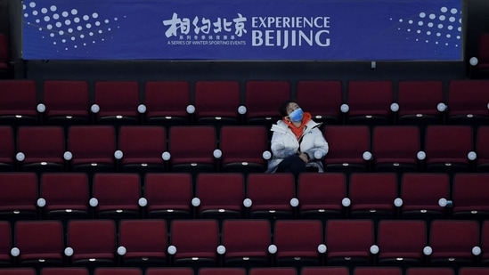The US president is under pressure at home to speak out on China’s human rights abuses. In picture - A staff member watching an ice hockey match, part of a 2022 Beijing Winter Olympic Games test event, at the Wukesong Sports Centre in Beijing.(AFP) The US president is under pressure at home to speak out on China’s human rights abuses. In picture - A staff member watching an ice hockey match, part of a 2022 Beijing Winter Olympic Games test event, at the Wukesong Sports Centre in Beijing.(AFP)