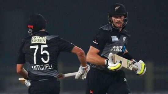 New Zealand's Martin Guptill, right, and Daryl Mitchell runs between the wickets during the second T20 cricket match between India and New Zealand, in Ranchi, India, Friday, Nov. 19, 2021. (AP)