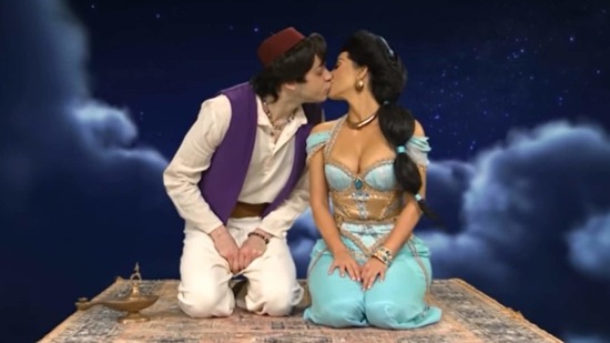 Pete Davidson and Kim Kardashian kiss each other during a skit on Saturday Night Live.(NBC)