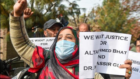 Leaders and workers of J&K People's Conference hold placards and shout slogans during a protest demanding a probe into the killings of civilians Altaf Ahmad Bhat and Mudasir Gul in Srinagar on Thursday. (PTI)