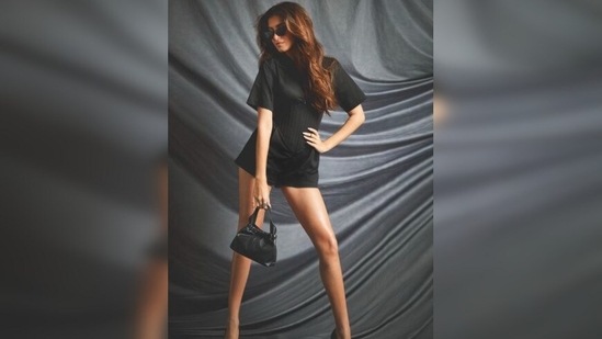 Tara Sutaria flaunted her long toned legs and teamed her look with a pair of black pointed stilettos.(Instagram/@tarasutaria)