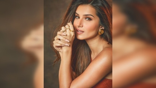 Tara Sutaria, who will next be seen in Tadap, stepped out to celebrated her birthday with Ahan Shetty and other co-stars at Mehboob Studio donning this stunning fit by Mannat Gupta.(Instagram/@tarasutaria)