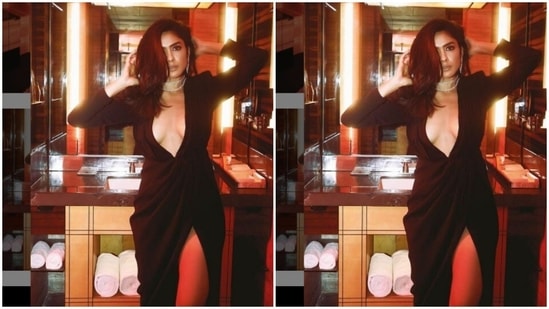 A few days back, Mrunal shared another look from her promotion diaries. This time she slayed bawse lady vibes in a midriff-baring black wrap-around dress.(Instagram/@mrunalthakur)