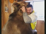 This pet bear 'asked' its human for a good old bear hug. (Jukin Media)