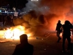 In this image taken from video, demonstrators in Rotterdam protest against government Covid-19 restrictions on Friday.(AP Photo) In this image taken from video, demonstrators in Rotterdam protest against government Covid-19 restrictions on Friday.(AP Photo)