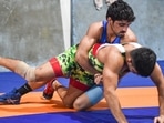 Wrestler Aman Sehrawat (on top), who will make his senior India debut in the 57kg weight category at the Commonwealth Championships in Pretoria, trains at the Chhatrasal Stadium in New Delhi.(Sanchit Khanna/ Hindustan Times) Wrestler Aman Sehrawat (on top), who will make his senior India debut in the 57kg weight category at the Commonwealth Championships in Pretoria, trains at the Chhatrasal Stadium in New Delhi.(Sanchit Khanna/ Hindustan Times)
