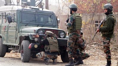 Army personnel stand guard near an encounter site, at Ashmuji, in Kulgam on Saturday. A district commander of terror outfit Hizbul Mujahideen was killed. (ANI)