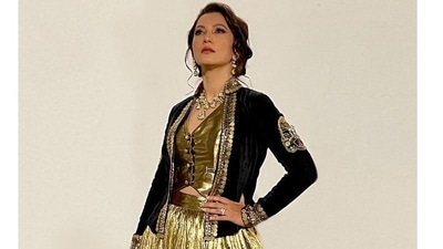 The pictures featured the actor donning a lehenga made of crush gold silk jacquard and teamed with a plain gold cut sleeves waist-coat/corset that came with a dori back detailing. (Instagram/gauaharkhan)