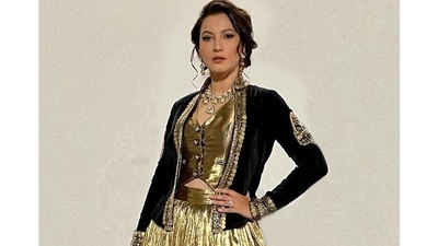 The lehenga choli is credited to Indian celebrity designer, Ashna Vaswani's eponymous label and originally costs  <span class='webrupee'>₹</span>18,000 on the designer website. (Instagram/gauaharkhan)
