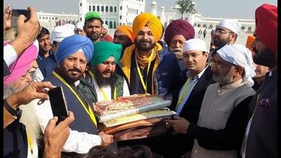 Punjab president Navjot Singh Sidhu with party leaders paying obeisance at Gurdwara Darbar Sahib at Kartarpur Sahib in Pakistan on Saturday. (PTI) Punjab president Navjot Singh Sidhu with party leaders paying obeisance at Gurdwara Darbar Sahib at Kartarpur Sahib in Pakistan on Saturday. (PTI)