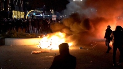 In this image taken from video, demonstrators in Rotterdam protest against government Covid-19 restrictions on Friday. (AP Photo)