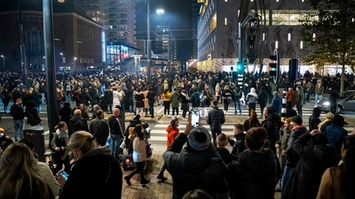 Demonstrators take part in a protest against a partial coronavirus lockdown and against the government policy in Rotterdam. (AFP) Demonstrators take part in a protest against a partial coronavirus lockdown and against the government policy in Rotterdam. (AFP)
