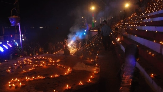 Dev Deepawali is also known as Tripurotsav because on this day, Lord Shiva primarily defeated the asura Tripurasura. On the occasion, the ghats of Varanasi were lit by 12 lakh earthen lamps.(HT Photo/Rajesh Kumar)