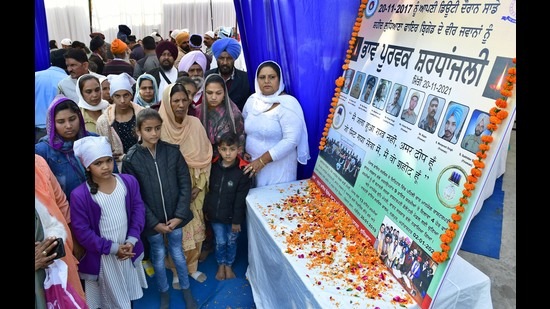 Family members of firefighters at building factory site at Janakpuri in Ludhiana on Saturday. (Harsimar Pal Singh/HT)