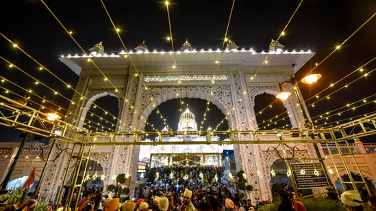 Delhi's Gurudwara Bangla Sahib was also illuminated and devotees thronged the Gurudwara on the auspicious occasion of Guru Nanak Jayanti.(PTI)