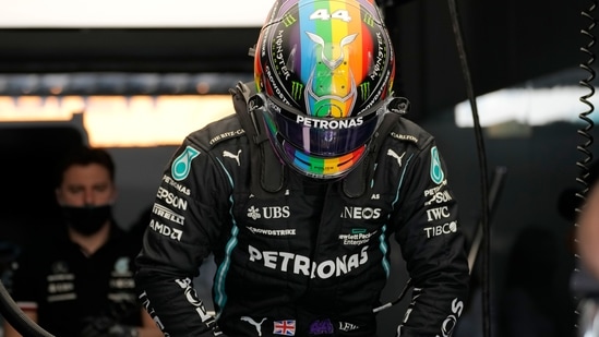 Mercedes driver Lewis Hamilton of Britain wears a new rainbow helmet during practice session in Lusail, Qatar, Saturday, Nov. 20, 2021 ahead of the Qatar Formula One Grand Prix. (AP)