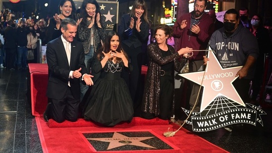 Salma Hayek (2nd L) reacts as her Hollywood Walk of Fame Star is unveiled.(AFP)