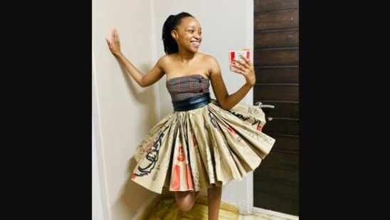 This woman created a dress out of recycled KFC packaging.&nbsp;(twitter/@NokuzothaNtuli)