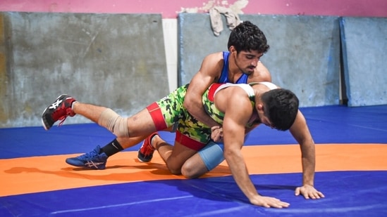Wrestler Aman Sehrawat (on top), who will make his senior India debut in the 57kg weight category at the Commonwealth Championships in Pretoria, trains at the Chhatrasal Stadium in New Delhi.(Sanchit Khanna/ Hindustan Times)