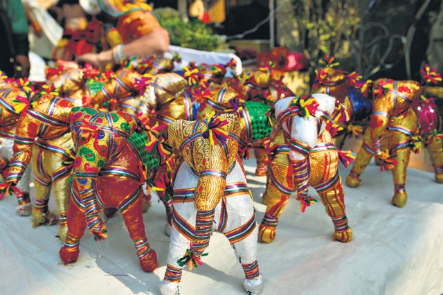 The exhibition with over 200 stalls features vibrant tribal handicrafts, art, and paintings.