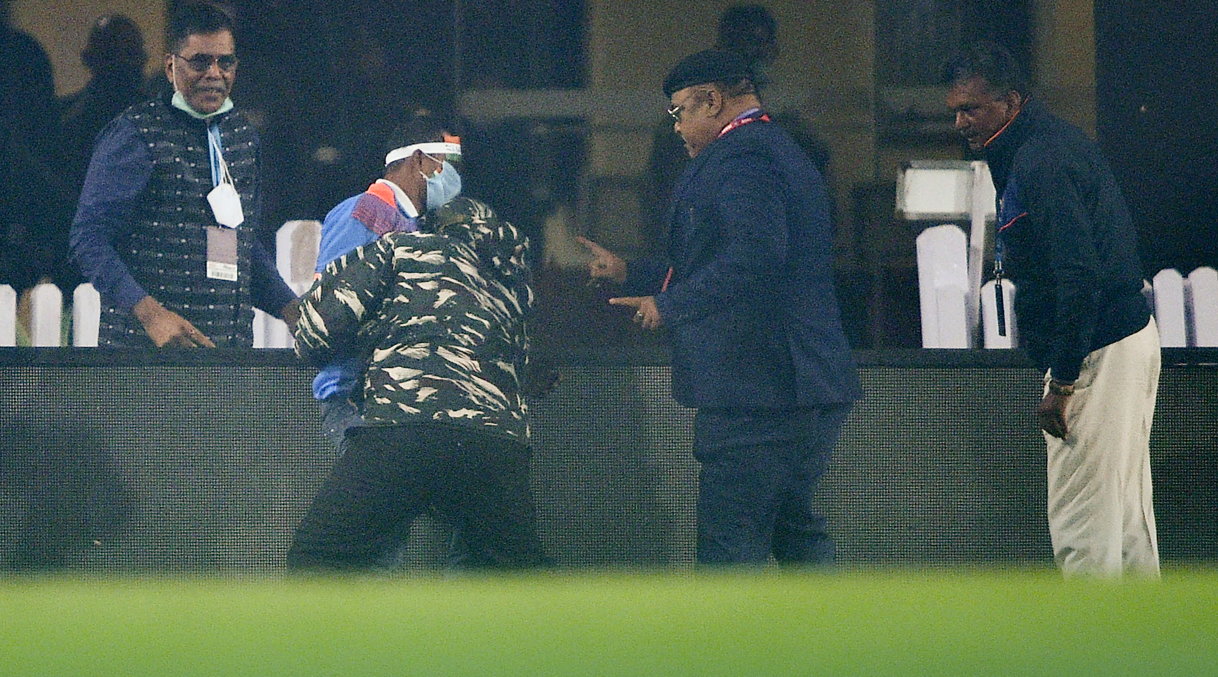 Security people detain a fan after he entered the field during 2nd Twenty20 cricket match between India and New Zealand at JSCA International Stadium Complex in Ranchi, (PTI) Security people detain a fan after he entered the field during 2nd Twenty20 cricket match between India and New Zealand at JSCA International Stadium Complex in Ranchi, (PTI)