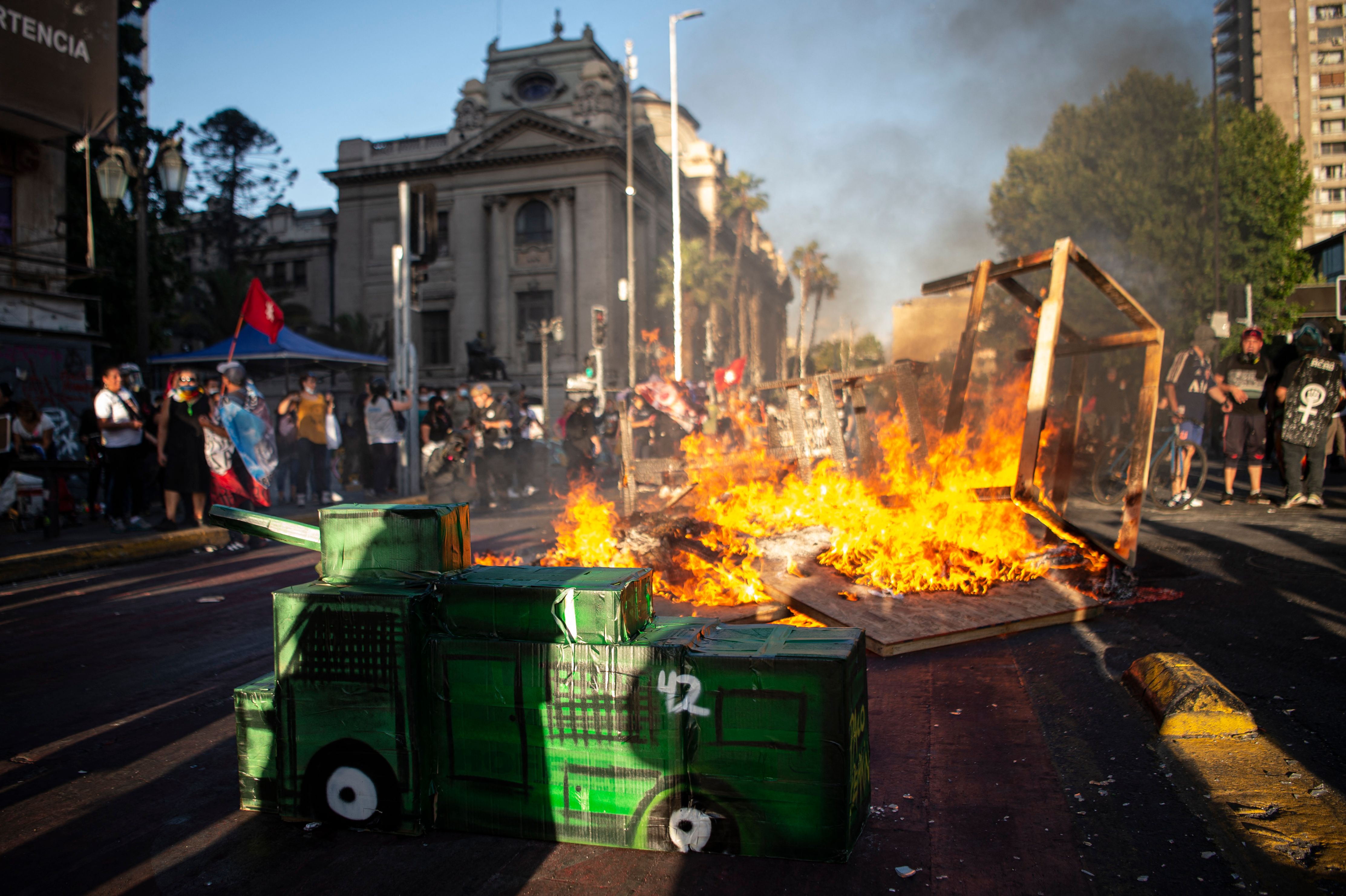 People protest against the Chilean government in Santiago on November 19, 2021, ahead of Sunday's general election. (Photo by Ernesto BENAVIDES / AFP)