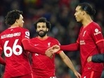 Liverpool's Trent Alexander-Arnold, Mohamed Salah, Virgil van Dijk celebrate at the end of the Premier League match against Arsenal. Liverpool's Trent Alexander-Arnold, Mohamed Salah, Virgil van Dijk celebrate at the end of the Premier League match against Arsenal.