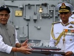 Defence minister Rajnath Singh receives a momento from Chief of Naval Staff Admiral Karambir Singh during the commissioning ceremony of the INS Visakhapatnam,at the naval base in Mumbai on November 21, 2021. Defence minister Rajnath Singh receives a momento from Chief of Naval Staff Admiral Karambir Singh during the commissioning ceremony of the INS Visakhapatnam,at the naval base in Mumbai on November 21, 2021.