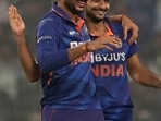India's Axar Patel, left, and Harshal Patel celebrate the dismissal of New Zealand's Glenn Phillips during the third Twenty20 cricket match between India and New Zealand in Kolkata, India, Sunday, Nov. 21, 2021. (AP Photo/Bikas Das)(AP)