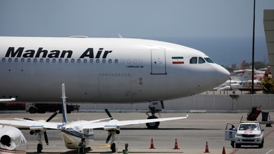 Passengers get off a Mahan Air aircraft at the airport in Kabul (AFP) Passengers get off a Mahan Air aircraft at the airport in Kabul (AFP)