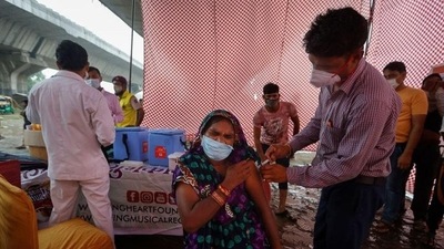 A woman receives a dose of the Covid-19 vaccine in New Delhi, India. (Reuters) A woman receives a dose of the Covid-19 vaccine in New Delhi, India. (Reuters)