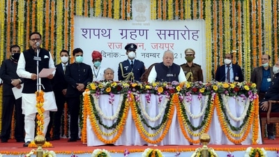 Rajasthan governor Kalraj Mishra administers oath to Mahesh Joshi as Cabinet minister during swearing ceremony in Jaipur on Sunday. (ANI Photo) Rajasthan governor Kalraj Mishra administers oath to Mahesh Joshi as Cabinet minister during swearing ceremony in Jaipur on Sunday. (ANI Photo)