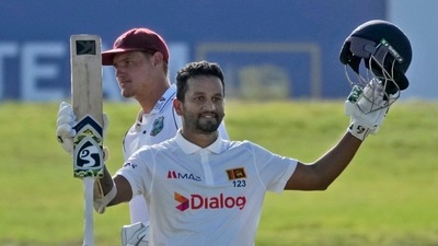 Galle: Sri Lankan captain Dimuth Karunaratne celebrates scoring a century during the day one of the first test cricket match between Sri Lanka and West Indies' in Galle, Sri Lanka, Sunday, Nov. 21, 2021. (AP) Galle: Sri Lankan captain Dimuth Karunaratne celebrates scoring a century during the day one of the first test cricket match between Sri Lanka and West Indies' in Galle, Sri Lanka, Sunday, Nov. 21, 2021. (AP)