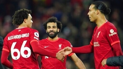 Liverpool's Trent Alexander-Arnold, Mohamed Salah, Virgil van Dijk celebrate at the end of the Premier League match against Arsenal. (AP) Liverpool's Trent Alexander-Arnold, Mohamed Salah, Virgil van Dijk celebrate at the end of the Premier League match against Arsenal. (AP)