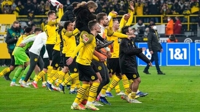 Dortmund players celebrate after winning the match against VfB Stuttgart (AP) Dortmund players celebrate after winning the match against VfB Stuttgart (AP)