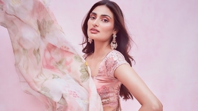 The pictures flooding the Internet ever since, feature Athiya donning a baby pink base half sleeves choli that sported bright pink and green floral prints and sequins embroidery all over. (Amigos Communications)