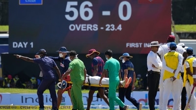 Supportive staff members carry West Indies' player Jeremy Solozano, on stretcher, to an ambulance after being hit by a shot played by Sri Lanka's Dimuth Karunaratne during the day one of the first test cricket match between Sri Lanka and West Indies' in Galle, Sri Lanka, Sunday, Nov. 21, 2021. (AP)