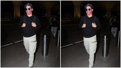 He accessorised his airport look with tinted shades and a black and white pair of sneakers. (HT Photos/Varinder Chawla) He accessorised his airport look with tinted shades and a black and white pair of sneakers. (HT Photos/Varinder Chawla)