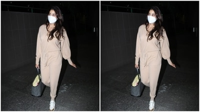 In an ivory white jumpsuit, Janhvi returned to the city. (HT Photos/Varinder Chawla) In an ivory white jumpsuit, Janhvi returned to the city. (HT Photos/Varinder Chawla)