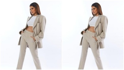 Tara teamed a white cropped top with a pair of white and ivory checkered formal trousers. (Instagram/@tarasutaria)