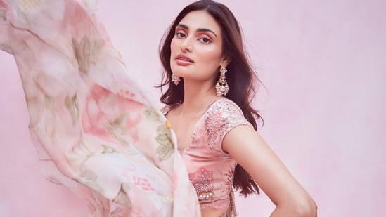 The pictures flooding the Internet ever since, feature Athiya donning a baby pink base half sleeves choli that sported bright pink and green floral prints and sequins embroidery all over.(Amigos Communications)