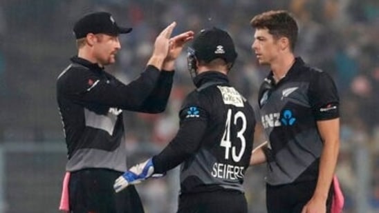 New Zealand's Mitchell Santner, right, and teammates celebrate the dismissal of India's Ishan Kishan during the third Twenty20 cricket match between India and New Zealand in Kolkata, India, Sunday, Nov. 21, 2021. (AP Photo/Bikas Das)(AP)